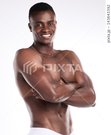African man, fitness and smile with arms crossed for sports goal, body challenge or weight loss. Portrait, male person or athlete for healthy diet, nutrition or wellness on white background in studio African man, fitness and smile with arms crossed for sports goal, body challenge or weight loss. Portrait, male person or athlete for healthy diet, nutrition or wellness on white background in studio 143643392