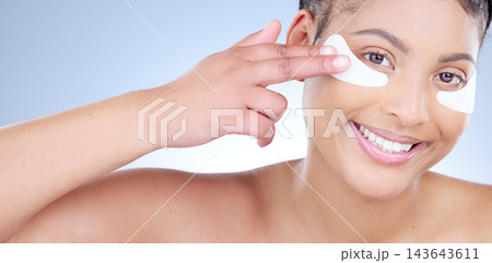 Beauty, eye mask and portrait of happy woman in studio on blue background for wellness. Cosmetics, face and smile with natural model at spa for aesthetic antiaging or cosmetology treatment banner Beauty, eye mask and portrait of happy woman in studio on blue background for wellness. Cosmetics, face and smile with natural model at spa for aesthetic antiaging or cosmetology treatment banner 143643611