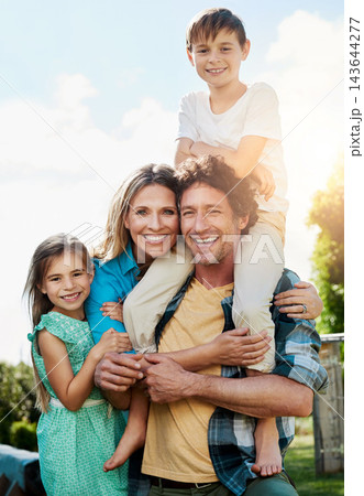 Family, portrait and smile with piggyback at park for weekend adventure, bonding and support. Summer, love and children with parents in nature for holiday, vacation and happiness on fathers day 143644277