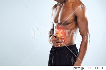 Man, stomach and muscle injury in studio for workout, training and gut health by white background. Person, bodybuilder and hands for pain in abdomen with red glow, exercise or fitness on mockup space Man, stomach and muscle injury in studio for workout, training and gut health by white background. Person, bodybuilder and hands for pain in abdomen with red glow, exercise or fitness on mockup space 143644491