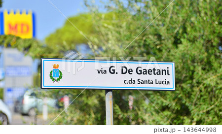 Cefalu, Italy. 22 August 2026. Urban landscape. Neon sign with the inscription: Via G, De Gaetani c da Santa Lucia Cefalu, Italy. 22 August 2026. Urban landscape. Neon sign with the inscription: Via G, De Gaetani c da Santa Lucia 143644998