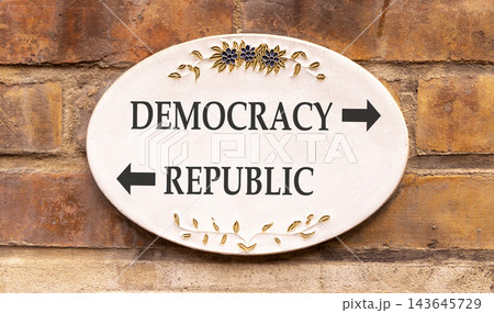 Democracy or republic words symbol. Concept words Democracy Republic on beautiful white sign plate. Beautiful brick wall background. Business democracy republic concept. Copy space Democracy or republic words symbol. Concept words Democracy Republic on beautiful white sign plate. Beautiful brick wall background. Business democracy republic concept. Copy space 143645729