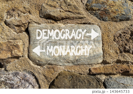 Democracy or monarchy words symbol. Concept words Democracy Monarchy on beautiful grey stone. Beautiful grey stone wall background. Business democracy monarchy concept. Copy space Democracy or monarchy words symbol. Concept words Democracy Monarchy on beautiful grey stone. Beautiful grey stone wall background. Business democracy monarchy concept. Copy space 143645733
