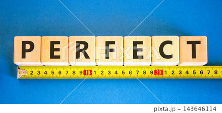 Perfect word symbol. Concept word Perfect on beautiful wooden blocks. Beautiful blue background. Beautiful yellow ruler. Business perfect word concept. Copy space. 143646114