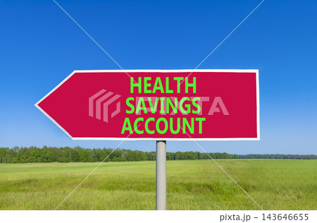 Health saving account symbol. Concept words Health saving account on beautiful red road sign. Beautiful blue sky green grass background. Medical Health saving account concept. Copy space. 143646655