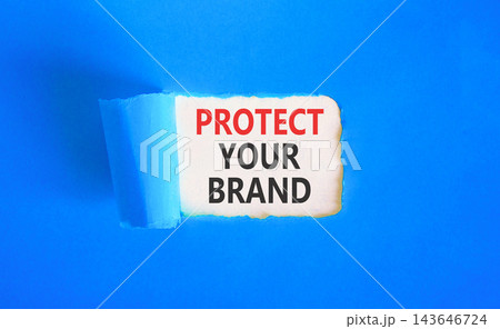 Protect your brand words symbol. Concept words Protect your brand on beautiful white paper. Beautiful blue background. Business and protect your brand concept. Copy space. 143646724