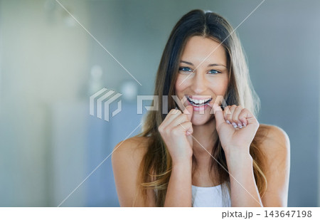 Woman, floss and hands for dental hygiene, portrait and face for fresh breathe and plaque. Gum, health and cleaning for happy female person, cosmetic and cavity prevention for teeth in home bathroom 143647198