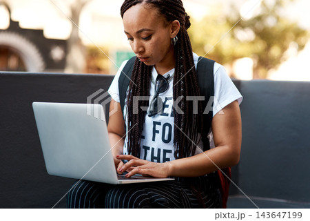 Woman, student and typing with laptop outside, busy and online classes for e learning or education. University, learner and website research for assignment information, college project and blog 143647199