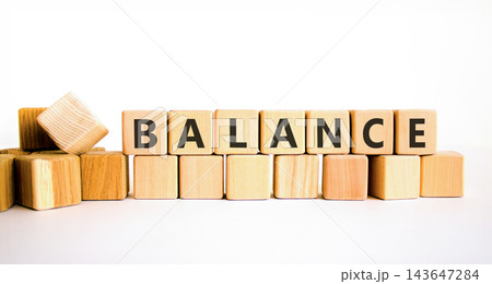 Balance word symbol. Concept word Balance on beautiful wooden blocks. Beautiful white table white background. Business medical balance word concept. Copy space. Balance word symbol. Concept word Balance on beautiful wooden blocks. Beautiful white table white background. Business medical balance word concept. Copy space. 143647284