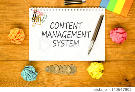 Content management system symbol. Concept words Content management system on beautiful white note. Beautiful wooden background. Colored paper. Business content management system concept. Copy space 143647905