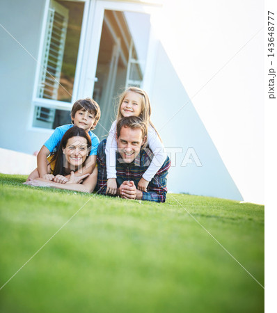 Portrait of mother, father and children on grass for backyard for bonding, love and relationship. Happy, family and dad, mom and kids on lawn for playing, childhood and relax together on weekend 143648777