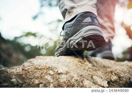 Fitness, feet and person in nature for hiking, training and morning cardio in a forest for journey, explore or adventure. Sports, shoes or athlete trekking in a park for wellness, walking or travel 143649090