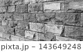 Angled Monochrome Split-Face Stone Brick Wall Texture 143649248
