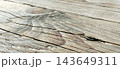 Aged Weathered Wood Plank Surface with Cracked Grain Texture 143649311