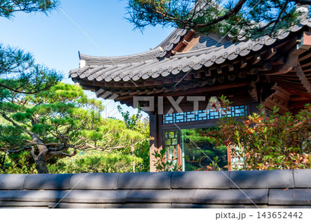 Traditional Korean Hanok Houses and Tiled Roofs against Bukhansan Mountain in Eunpyeong Hanok Village, Seoul 143652442