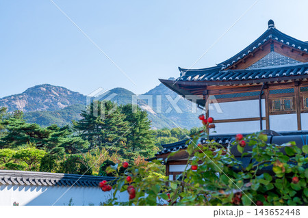 Traditional Korean Hanok Houses and Tiled Roofs against Bukhansan Mountain in Eunpyeong Hanok Village, Seoul 143652448