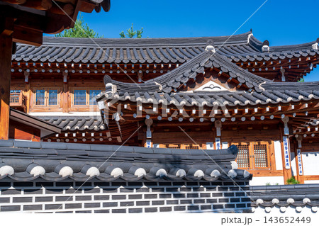 Traditional Korean Hanok Houses and Tiled Roofs against Bukhansan Mountain in Eunpyeong Hanok Village, Seoul Traditional Korean Hanok Houses and Tiled Roofs against Bukhansan Mountain in Eunpyeong Hanok Village, Seoul 143652449