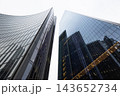 Futuristic architecture and curved glass facades of corporate business towers 143652734