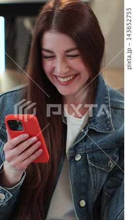 Vertical video. Woman recording answering by audio message in social network on mobile phone. Young woman call on phone closeup, use loudspeaker at home. Vertical video. Woman recording answering by audio message in social network on mobile phone. Young woman call on phone closeup, use loudspeaker at home. 143652755