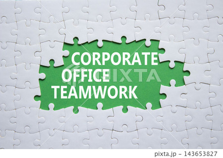 Corporate Office Teamwork symbol. White puzzle with words Corporate Office Teamwork. Beautiful green background. Business concept. Copy space. Corporate Office Teamwork symbol. White puzzle with words Corporate Office Teamwork. Beautiful green background. Business concept. Copy space. 143653827