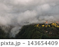Aerial View of Mountain Village in Morning Fog 143654409