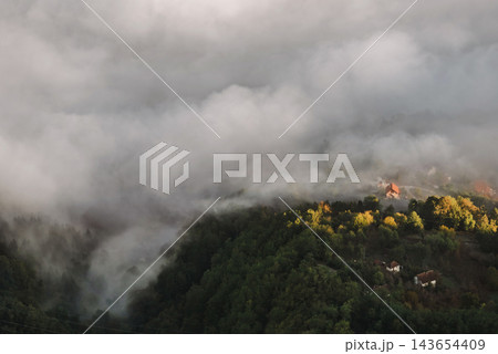 Aerial View of Mountain Village in Morning Fog Aerial View of Mountain Village in Morning Fog 143654409