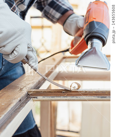 Carpenter at work, restoring an old wooden window. Carpentry. Carpenter at work, restoring an old wooden window. Carpentry. 143655608