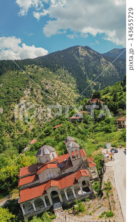Aerial view of leaning Panagia Theotokos church in sunken ghost village Ropoto caused by severe landslide in Thessaly, Greece, surrounded by mountains Aerial view of leaning Panagia Theotokos church in sunken ghost village Ropoto caused by severe landslide in Thessaly, Greece, surrounded by mountains 143655729