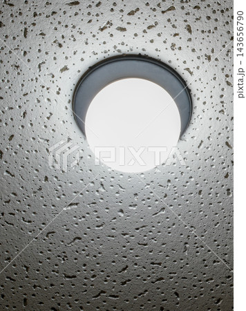 Modern Round LED Ceiling Light on Textured Concrete Surface with Decorative Pores and Rough Finish Modern Round LED Ceiling Light on Textured Concrete Surface with Decorative Pores and Rough Finish 143656790