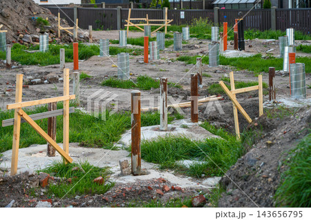 Pile Foundation for Modular Home Construction with Steel Posts, Concrete Bases and Underground Utilities 143656795