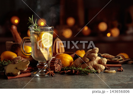 Ginger tea with lemon on a stone table. 143656806