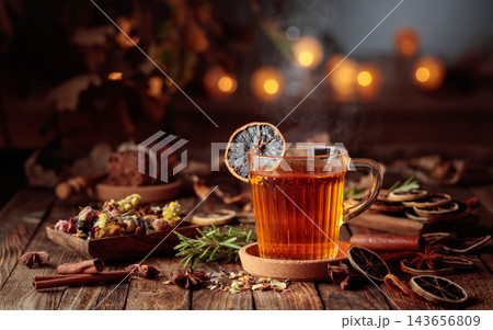 Autumn herbal tea with cinnamon, anise, and dried citrus slices. 143656809