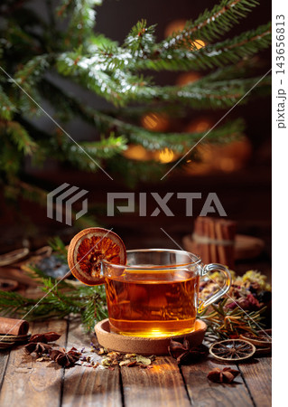 Christmas herbal tea with cinnamon, anise, and dried citrus slices. Christmas herbal tea with cinnamon, anise, and dried citrus slices. 143656813