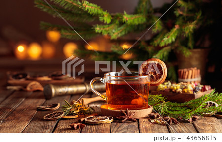 Christmas herbal tea with cinnamon, anise, and dried citrus slices. 143656815
