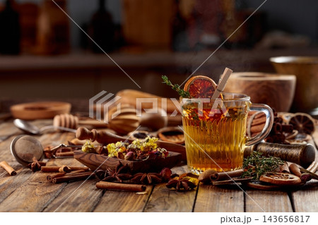 Herbal tea with thyme and dried orange slice. Herbal tea with thyme and dried orange slice. 143656817