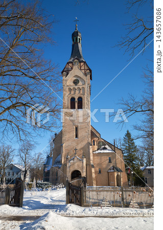Old ancient Dubulti Lutheran Church in Jurmala, Latvia. Historic architecture near the Baltic Sea on a sunny winter day. Old ancient Dubulti Lutheran Church in Jurmala, Latvia. Historic architecture near the Baltic Sea on a sunny winter day. 143657086