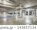 Modern empty underground parking garage interior and concrete columns 143657134