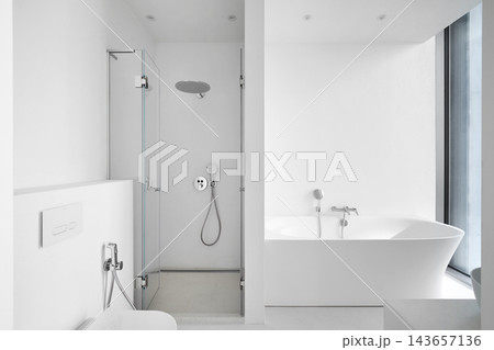 Modern empty bathroom interior mockup with white bathtub, glass shower cabin, and toilet. 143657136