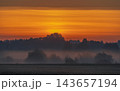 Fields covered in fog in Kernave, Lithuania 143657194