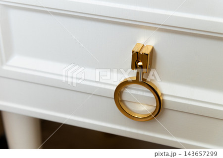 Gold Zipper Handle on White Drawer 143657299