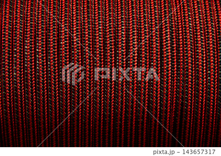 Red and black braided rope texture pattern background Red and black braided rope texture pattern background 143657317