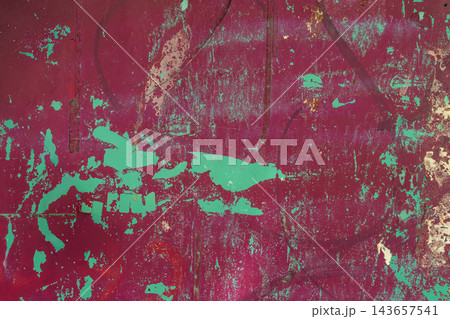 Burgundy and Turquoise Grunge Texture With Peeling Paint. Vintage texture of weathered burgundy metal, peeling turquoise paint, scratches, distressed surface. Natural background for urban design 143657541