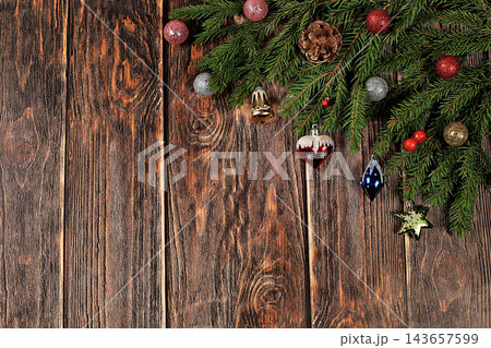 Festive winter greeting card and banner on the screen, Beautiful Christmas and New Year background with lights, decorations, toys and live fir branches, product design for holiday advertising, Festive winter greeting card and banner on the screen, Beautiful Christmas and New Year background with lights, decorations, toys and live fir branches, product design for holiday advertising, 143657599