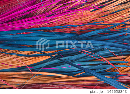 Abstract Background of Colorful Dyed Natural Palm Leaf Fibers 143658248