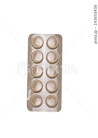 Blister pack containing ten round tablets in sealed pharmaceutical packaging isolated on a clean white background. Blister pack containing ten round tablets in sealed pharmaceutical packaging isolated on a clean white background. 143658436