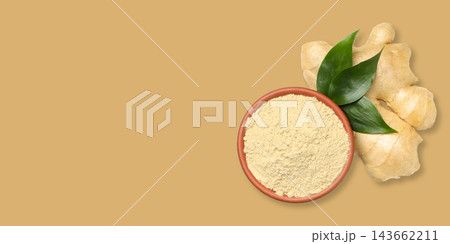 Ginger root and ginger powder are presented beautifully on a neutral background 143662211