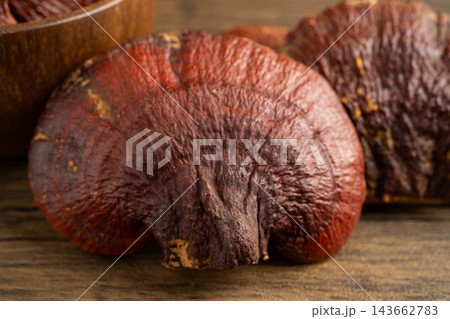 Dried lingzhi mushroom with capsule drug, alternative medicine herbal organic herb. 143662783