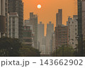 Hong Kong Oct 13 2026 Glowing Crimson Sun Setting Between High Rise Skyscrapers 143662902