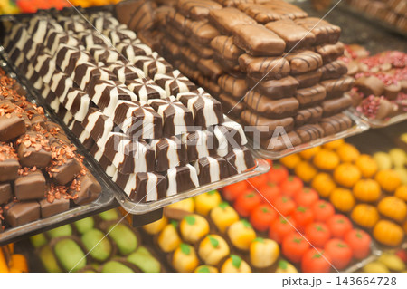 Chocolate and candy displayed in a shop with colorful sweets and treats Chocolate and candy displayed in a shop with colorful sweets and treats 143664728