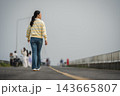 woman walking on a road on mountain in morning 143665807